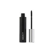 Black mascara with silver cap on a white background, featuring the 'Merit' brand.
