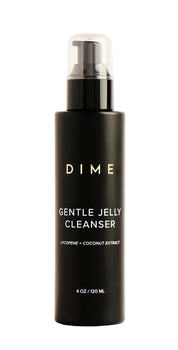 Black bottle of DIME Gentle Jelly Cleanser on a beige background